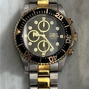 Invicta Black Dial Watch with Gold and Silver Accents
